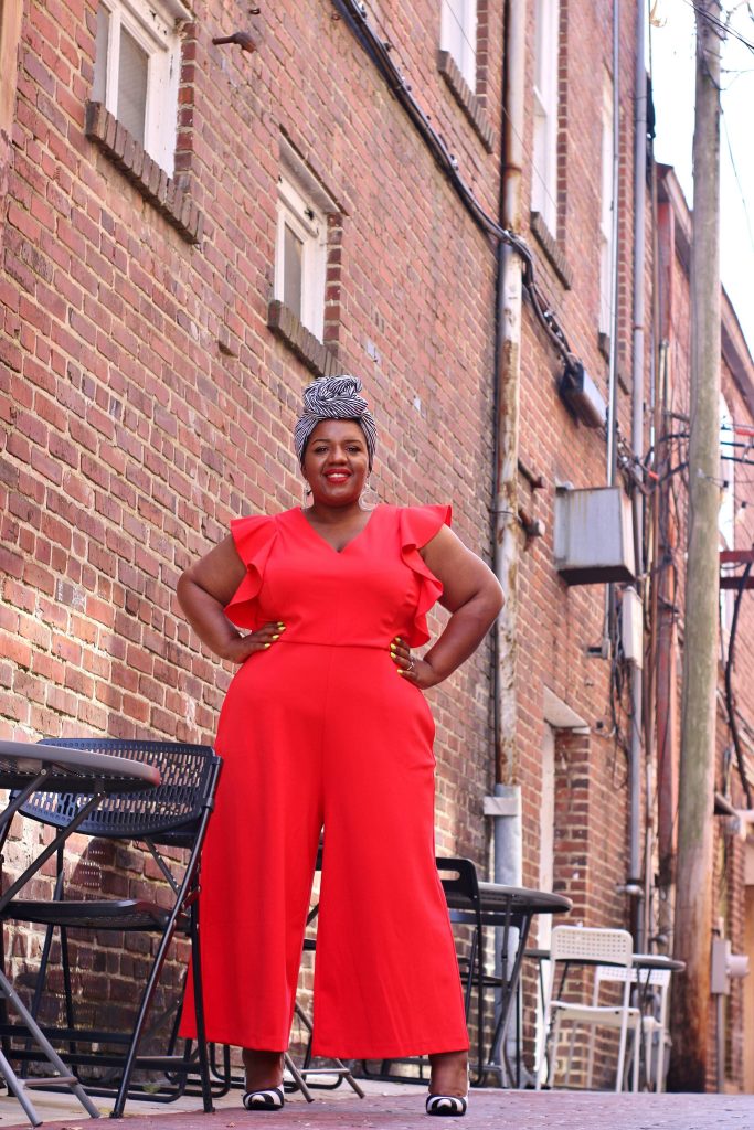 Plus Size Woman wearing a red jumpsuit