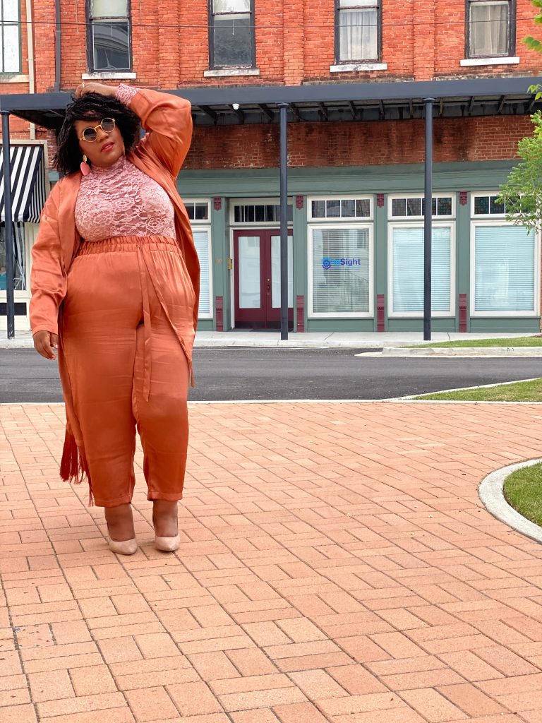 Plus size woman in Eloquii matching suit