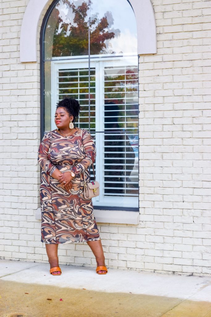 Plus size woman wearing marble print set from Asos
