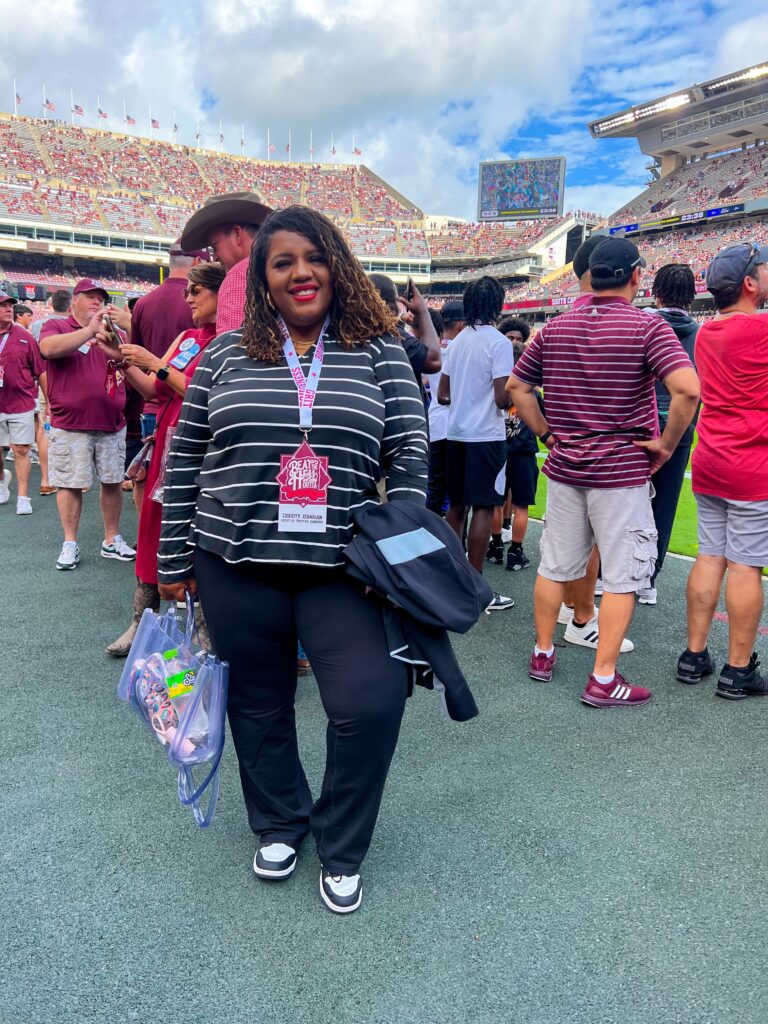 Plus Size woman wearing Lane Bryant LIVI Active at Texas A&M Football Game