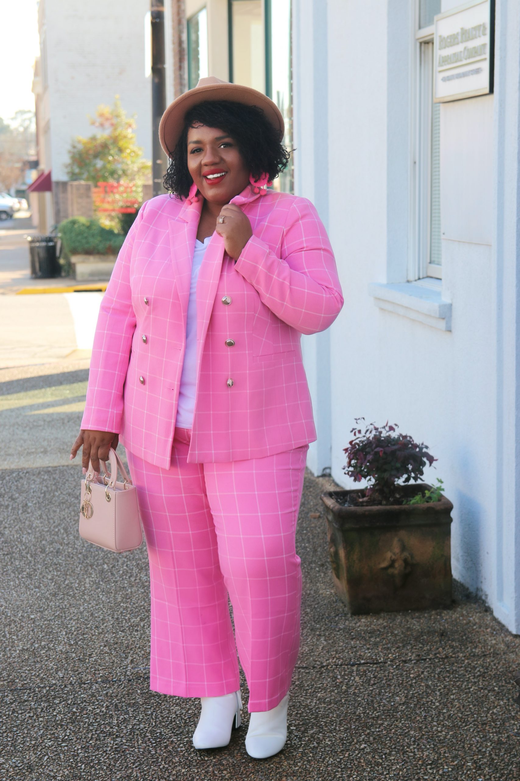 plus size woman in a pink suit set