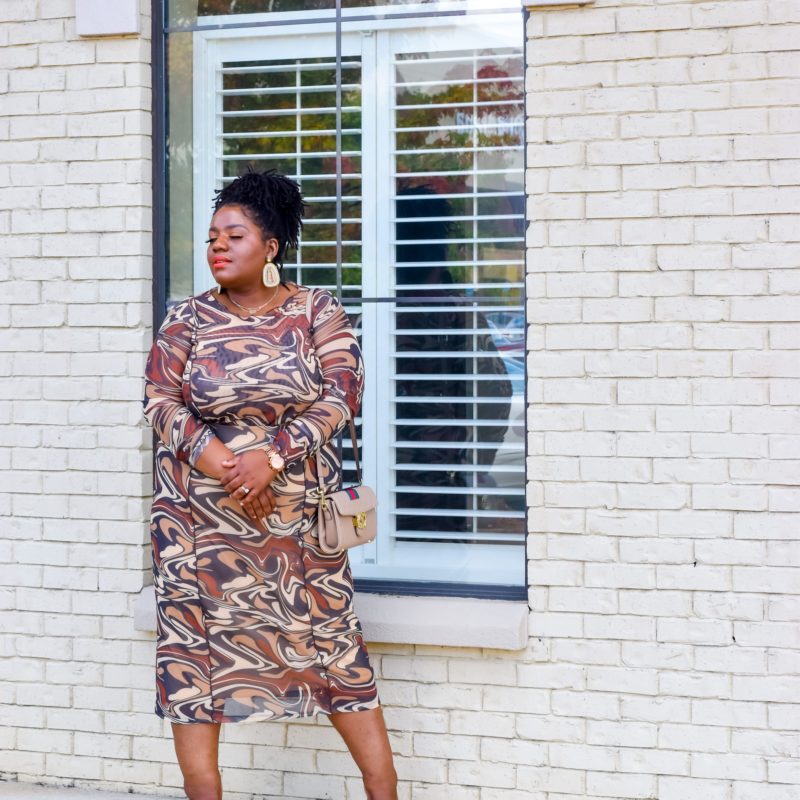 Plus size woman wearing marble print set from Asos