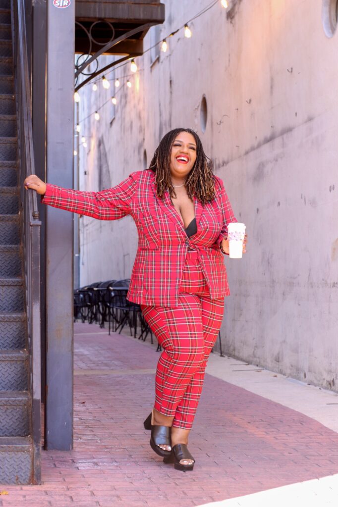 Plus size woman in plaid suit 